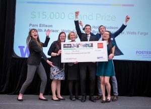 BioPots accepting the $15,000 Wells Fargo prize for their biodegradable planter pots made from biomass waste