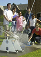 children watch a water rocket blast off