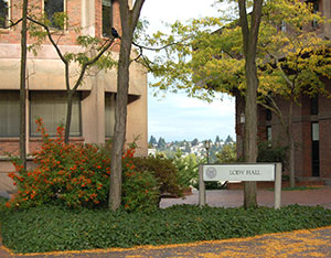 Loew Hall sign with fallen leaves