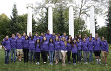 Group of STARS students in purple sweatshirts on the UW Seattle campus