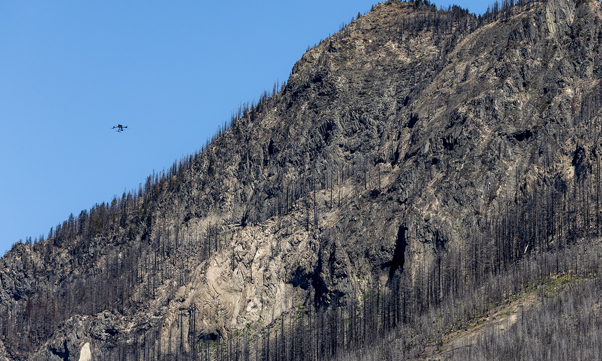 Drone flying by hill