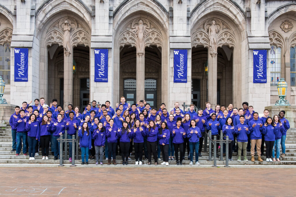 Image of a group of students standing in front of Suzzallo Library