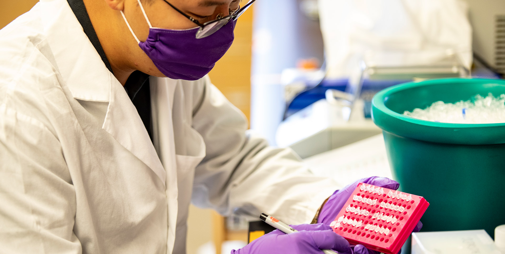 Student wearing PPE in research lab