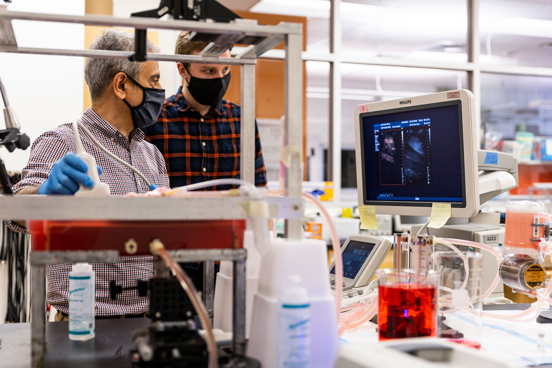 Averkiou and Krolak scanning a liver model with looking at a monitor