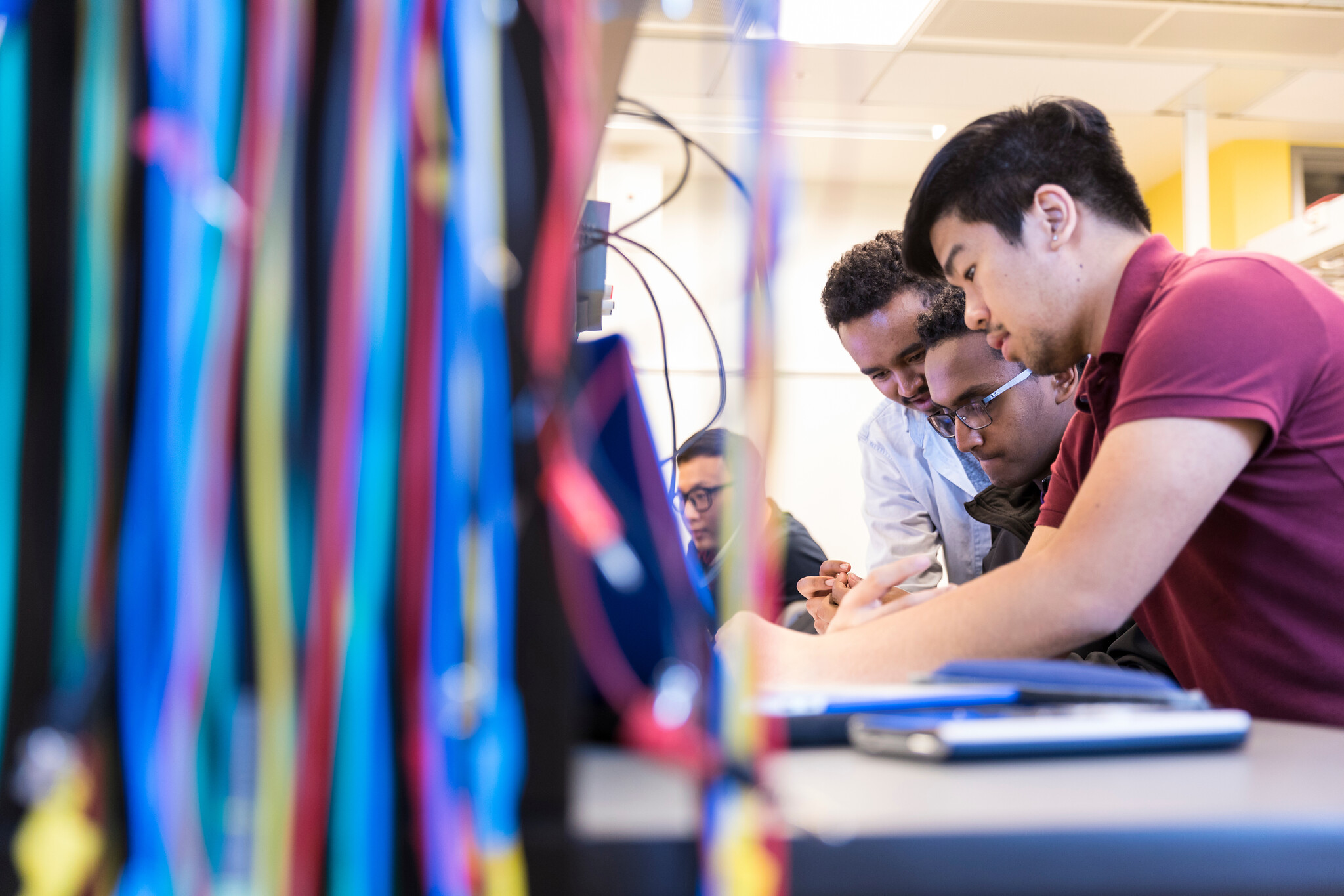 Engineering students work in class on campus