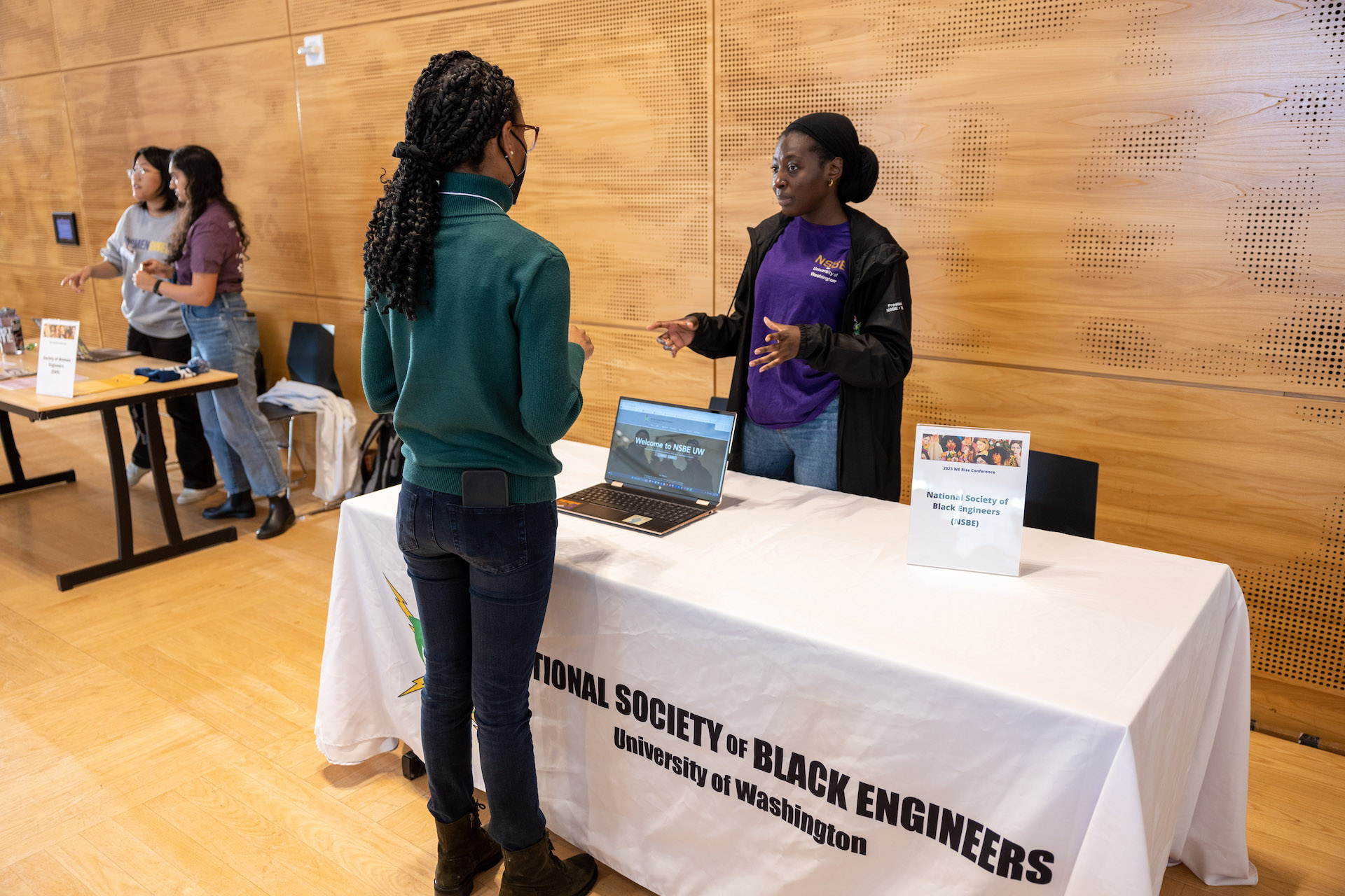 Two people talking during an event