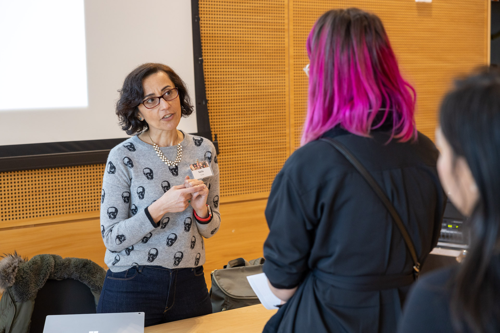 Two women talking at an event