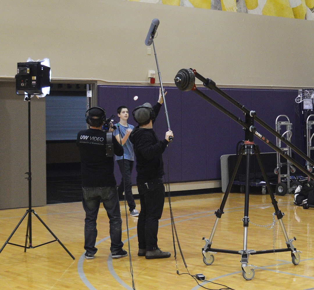 Production crew filming in a room at a UW campus