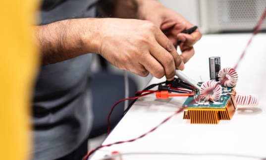 Student connecting the circuit with coils