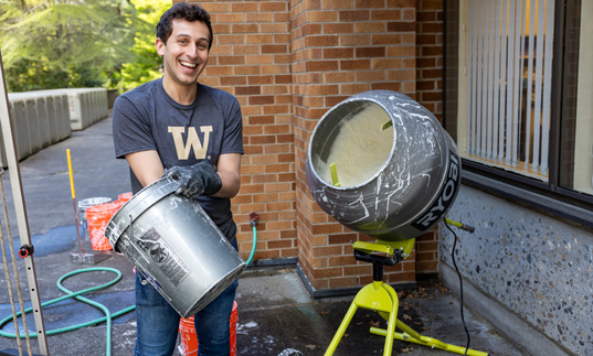 Engineering student mixing liquid goop