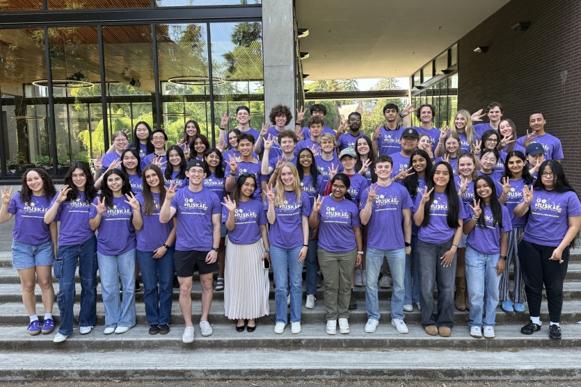 Group photo of Engineering Peer Educators outside in matching purple t-shirts.