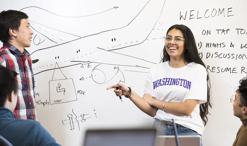 two students at a whiteboard