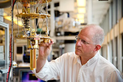 Professor Charles Marcus makes adjustments on equipment in his lab at the Niels Bohr Institute in Copenhagen, Denmark.