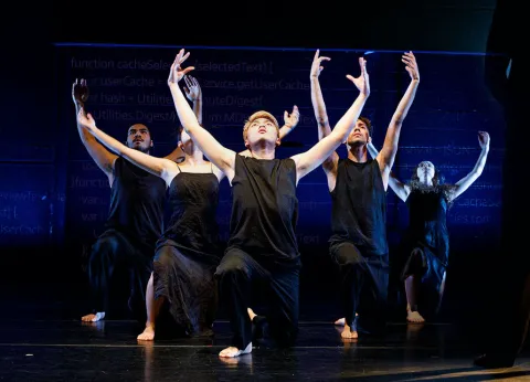 A group of students dancing on stage