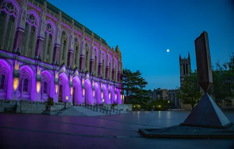 UW building light up in purple