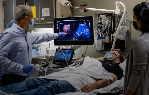 Mike Averkiou, left, Barry Lutz, center, and Manjiri Dighe, right, during a recent contrast-enhanced ultrasound of Lutz's liver