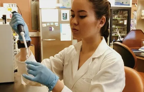 A woman working in a lab