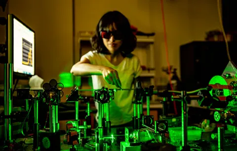 Researcher working in lab in front of computer