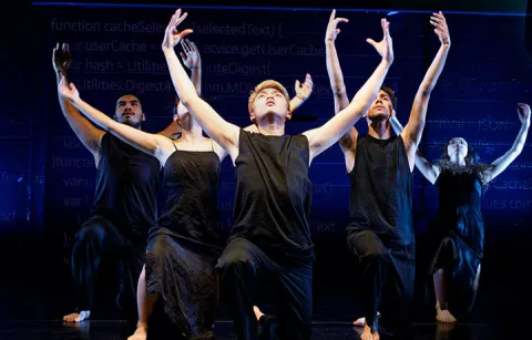 Students performing dance on stage