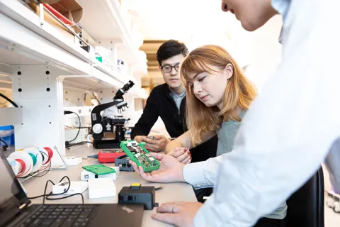 three people in a lab