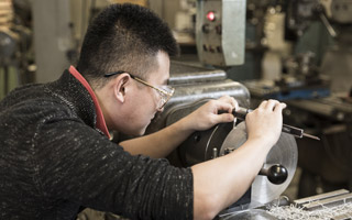 Student working on machine