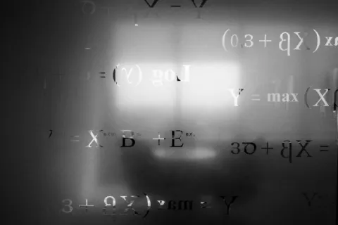 Mathematical equations on frosted glass. 