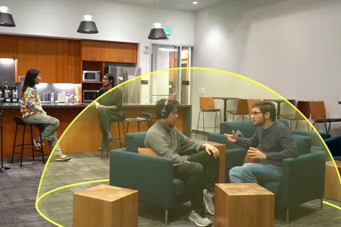 Two people sitting inside an AI generated sound bubble graphic