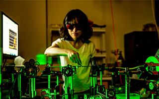 Student in lab setting wearing eye protection